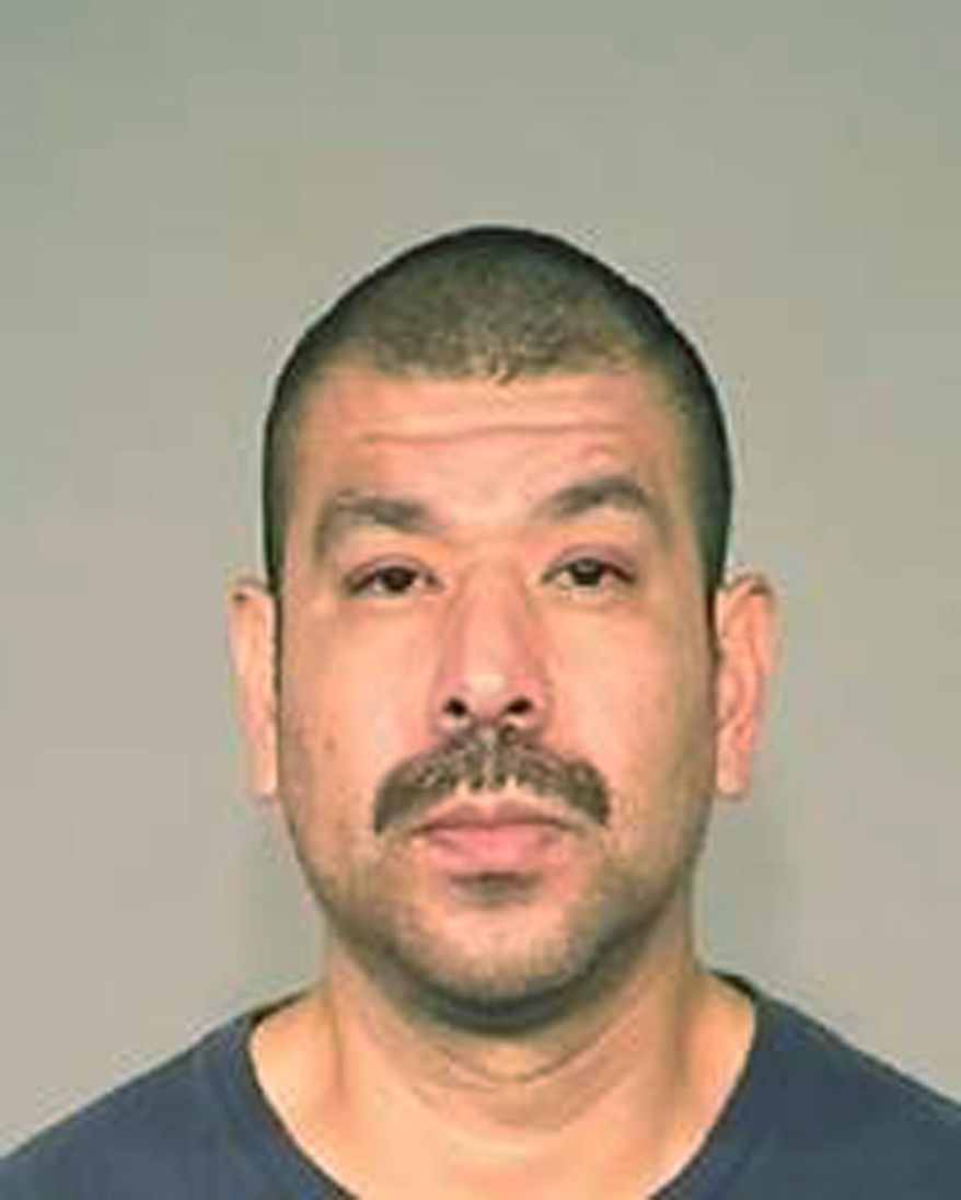 This Friday, May 18, 2018, booking photo released by the Fresno Police Department shows suspect Robert Gonzalez. Northern California police say they have arrested Gonzalez, 40, who allegedly violently abducted his former wife and her two young children. Fresno Police spokesman Mark Hudson says officers captured Gonzalez Friday and recovered his 2-year-old daughter. Gonzalez is accused of abducting her Thursday along with his ex-wife and her 11-month-old son who escaped earlier Friday. (Fresno Police Department via AP)