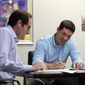 Michael Finkelstein works in his law office with attorney Scott Sternberg in New Orleans, Friday, May 18, 2018. Finkelstein, a high school student at Benjamin Franklin High School when Hurricane Katrina hit in 2005, was forced to relocate to Austin, Texas, now lives in New Orleans. This Sunday, officials at Franklin are welcoming back the class of 2006 and offering them honorary diplomas as a way to remember a group that was thrown across the country at a time when they should have been worried about homecoming and college applications.(AP Photo/Gerald Herbert)