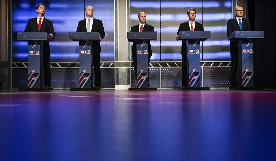 Georgia Republican gubernatorial candidates Michael Williams, standing from left, Clay Tippins, Hunter Hill, Brian Kemp and Casey Cagle wait to start a debate, Sunday, May 20, 2018, in Atlanta. (AP Photo/John Amis)