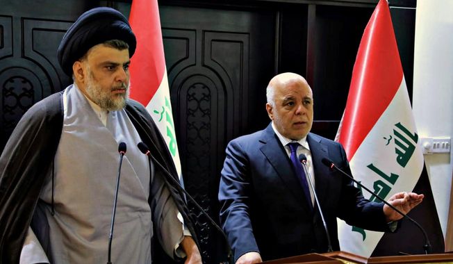 In this photo provided by the Iraqi government, Iraqi Prime Minister Haider al-Abadi, right, and Shiite cleric Muqtada al-Sadr hold a press conference in the heavily fortified Green Zone in Baghdad, Iraq, early Sunday, May 20, 2018. Shiite cleric Muqtada al-Sadr, whose coalition won the largest number of seats in Iraq&#x27;s parliamentary elections, says the next government will be &amp;quot;inclusive.&amp;quot; The May 12 vote did not produce a single bloc with a majority, raising the prospect of weeks or even months of negotiations to agree on a government. (Iraqi Government via AP) **FILE**