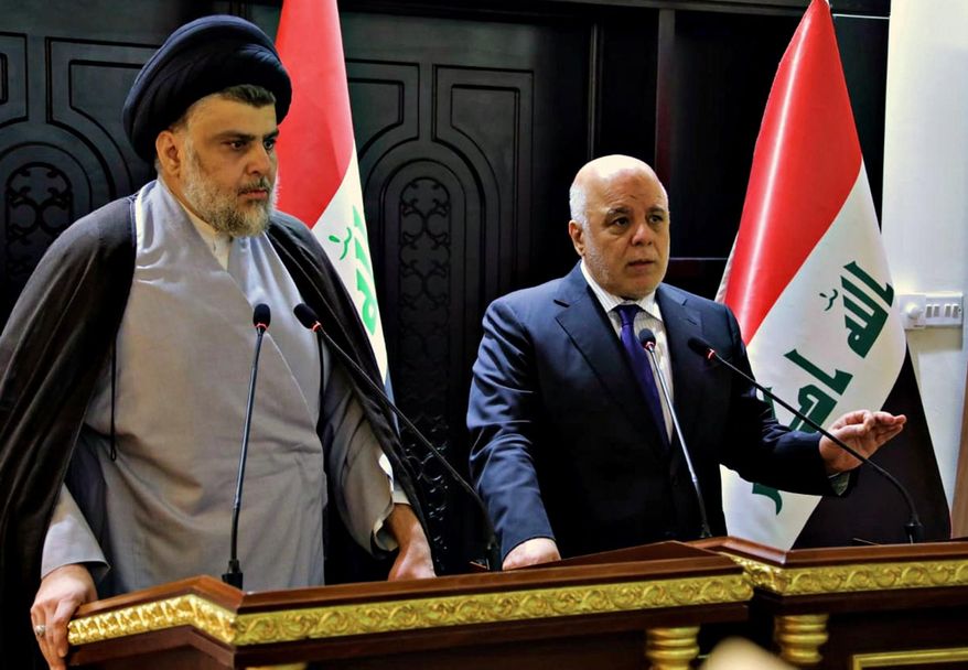 In this photo provided by the Iraqi government, Iraqi Prime Minister Haider al-Abadi, right, and Shiite cleric Muqtada al-Sadr hold a press conference in the heavily fortified Green Zone in Baghdad, Iraq, early Sunday, May 20, 2018. Shiite cleric Muqtada al-Sadr, whose coalition won the largest number of seats in Iraq&#39;s parliamentary elections, says the next government will be &amp;quot;inclusive.&amp;quot; The May 12 vote did not produce a single bloc with a majority, raising the prospect of weeks or even months of negotiations to agree on a government. (Iraqi Government via AP) **FILE**
