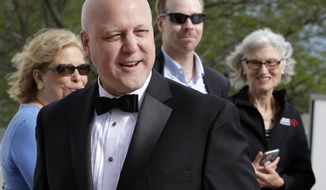 Former New Orleans Mayor Mitch Landrieu, front, arrives at the John F. Kennedy Presidential Library and Museum before 2018 Profile in Courage award ceremonies, Sunday, May 20, 2018, in Boston. Landrieu is scheduled to be presented with the award during ceremonies Sunday. (AP Photo/Steven Senne)