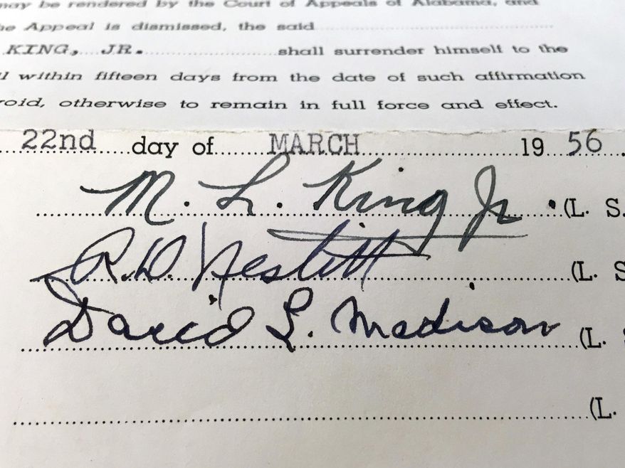 This photo shows the signature of the Rev. Martin Luther King Jr. on a court document in the archive of Alabama State University in Montgomery, Ala. The school is preserving and digitizing historic court documents linked to the civil rights movement that were found in a box at the county courthouse. (Alabama State University via AP)