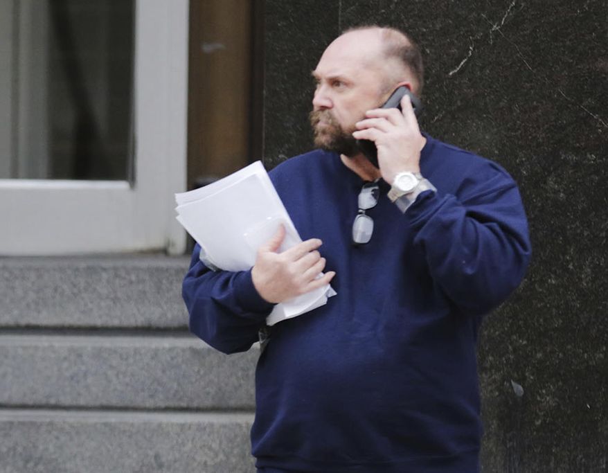 FILE - In this Feb. 2, 2016, file photo, Arthur Rathburn of Grosse Pointe Park, Mich., walks out of Theodore Levin United States Courthouse in Detroit. Prosecutors are seeking a 14-year prison sentence for Rathburn convicted of dealing diseased body parts for medical training. He is returning to Detroit federal court on Monday, May 21, 2018, four months after he was convicted of fraud and shipping hazardous material. (Regina H. Boone/Detroit Free Press via AP)