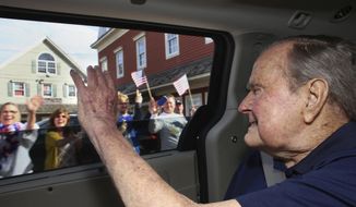 In this Sunday, May 20, 2018, photo provided by the office of former President George H.W. Bush, the former president waves to supporters as his motorcade arrives in Kennebunkport, Maine. A Bush spokesman said the nation&#39;s 41st president was eager to get to Maine after enduring his wife&#39;s death and then falling ill with a blood infection that landed him in the hospital. (Evan Sisley via AP)