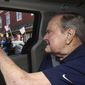 In this Sunday, May 20, 2018, photo provided by the office of former President George H.W. Bush, the former president waves to supporters as his motorcade arrives in Kennebunkport, Maine. A Bush spokesman said the nation&#39;s 41st president was eager to get to Maine after enduring his wife&#39;s death and then falling ill with a blood infection that landed him in the hospital. (Evan Sisley via AP)