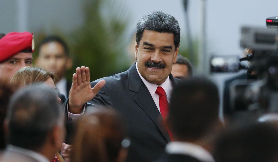 Venezuela&#39;s President Nicolas Maduro arrives to the government-controlled National Electoral Council to be officially declared the winner of the presidential election, in Caracas, Venezuela, Tuesday, May 22, 2018. (AP Photo/Ariana Cubillos)