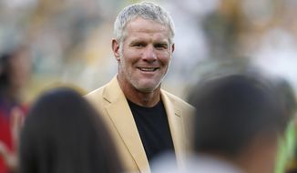 In this Oct. 16, 2016, file photo, Hall of Fame quarterback Brett Favre is shown during a halftime ceremony of an NFL football game against the Dallas Cowboys, in Green Bay, Wis. (AP Photo/Matt Ludtke, File)
