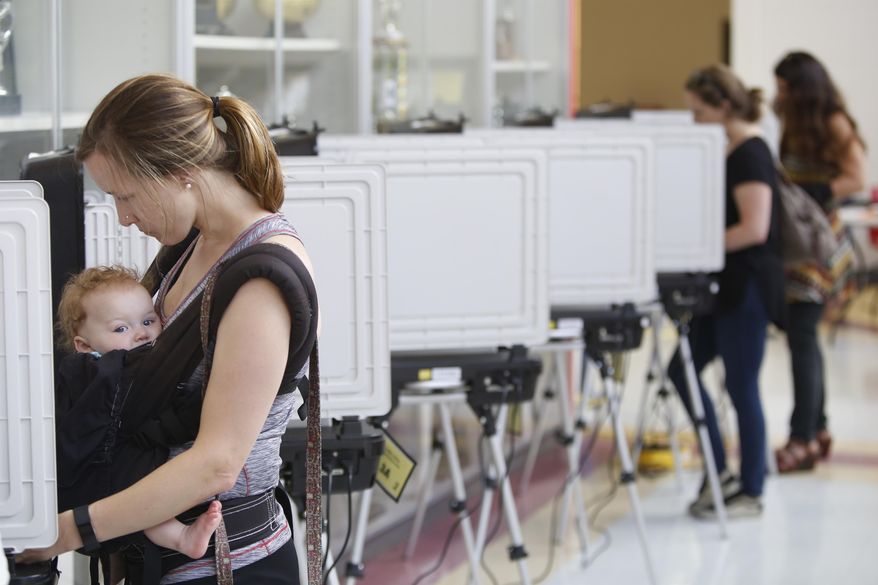 Voters cast their ballots at Clarke Central High School in Athens, Ga., Tuesday, May 22, 2018. (Joshua L. Jones/Athens Banner-Herald via AP)