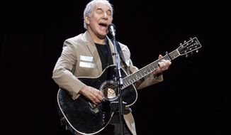 FILE - In this May 16, 2018 file photo, Paul Simon kicks off his Homeward Bound: The Farewell Tour in Vancouver, British Columbia. Simon, who&#39;s 76, isn&#39;t retiring. He has a disc due out this fall and promises he&#39;ll still occasionally appear on stage. Since he started writing songs as a teen-ager, it&#39;s hard to imagine that impulse shutting off forever. He’s done with the idea of long concert tours, so if you live in Greensboro, Austin or Orlando and want to see him perform, this is it. (Jimmy Jeong/The Canadian Press via AP)