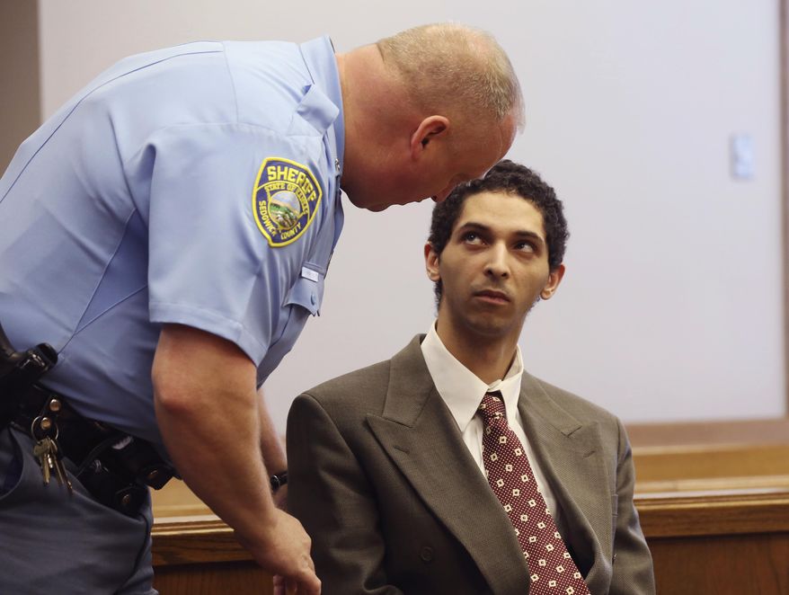 Tyler Barriss, left, appears before Judge Bruce Brown Tuesday, May 22, 2018 in a preliminary hearing in Wichita, Kan. Barriss is accused of calling police from Los Angeles on Dec. 28 to report a shooting and kidnapping at a Wichita home. The person who called said he shot his father in the head and was holding his mother and younger brother at gunpoint in a closet in the house in Wichita. Police went to the house where they thought the crime was occurring, and an officer fatally shot 28-year-old Andrew Finch after he opened the door. (Bo Rader/The Wichita Eagle via AP)