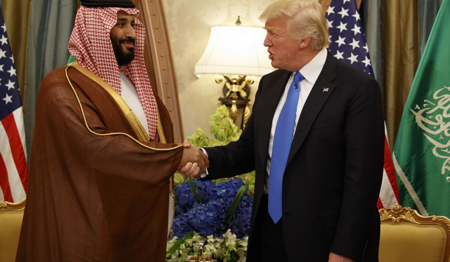 FILE - In this May 20, 2017, file photo, President Donald Trump shakes hands with Saudi Deputy Crown Prince and Defense Minister Mohammed bin Salman in Riyadh. In emails obtained by The Associated Press, George Nader claims he later met with Mohammed bin Salman, who by then had been elevated to crown prince, and Abu Dhabi’s crown prince, Sheikh Mohammed bin Zayed Al Nahyan, in a lobbying effort to alter U.S. policy in the Middle East. (AP Photo/Evan Vucci, File)