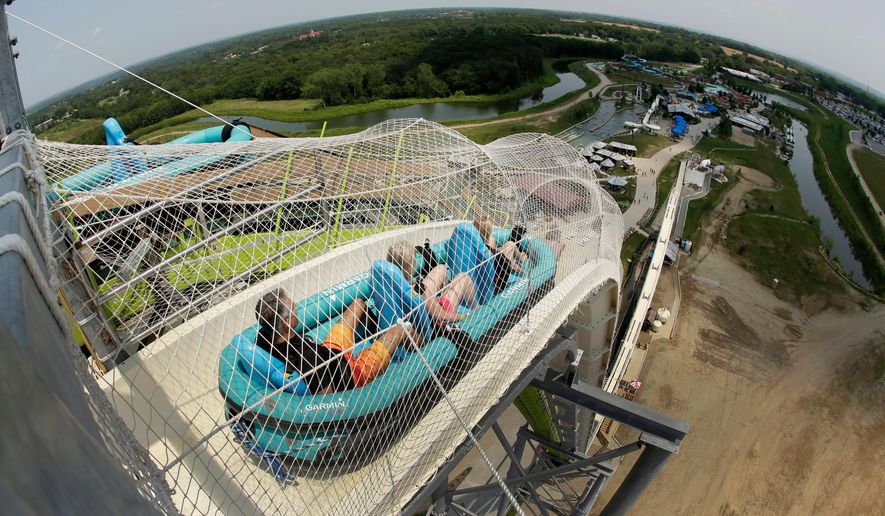 FILE - In this July 9, 2014, file photo, riders go down the water slide called &amp;quot;Verruckt&amp;quot; at Schlitterbahn Waterpark in Kansas City, Kan. A state inspection has found 11 alleged violations of regulations at the Kansas water park where a 10-year-old boy died in 2016. The Kansas Department of Labor made an audit of the Schlitterbahn park in Kansas City public Tuesday, May 22, 2018, a day after issuing a notice to the park. The audit said safety signs in some park areas were not adequate, records were not available for review and some operating and training manuals were not complete. (AP Photo/Charlie Riedel, File)