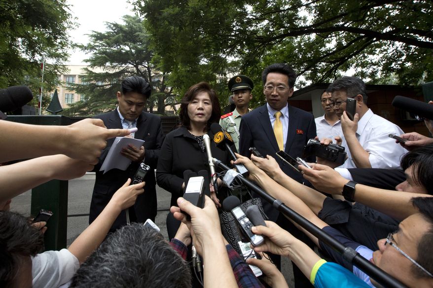 Choe Son Hui, deputy director general of the Department of U.S. Affairs of North Korean Foreign Ministry, briefs journalists outside the North Korean embassy in Beijing Thursday, June 23, 2016. Choe is in Beijing to attend the Northeast Asia Cooperation Dialogue and said North Korea is confident of coping with nuclear war. (AP Photo/Andy Wong)