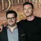 In this Feb. 20, 2017, file photo, actor Josh Gad, left, who plays manservant LeFou and Luke Evans who plays villain Gaston, pose during a promotional event for the movie &quot;Beauty and the Beast&quot; in Paris. Walt Disney has shelved the release of its new movie &quot;Beauty and the Beast&quot; in mainly Muslim Malaysia, even though film censors said Tuesday, March 14, 2017, it had been approved with a minor cut involving a &quot;gay moment&quot; between two characters in the film. (AP Photo/Christophe Ena, File)
