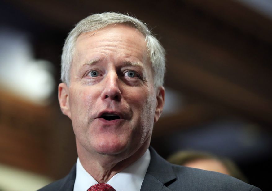 FILE - In this July 19, 2017, file photo, Freedom Caucus Chairman Rep. Mark Meadows, R-S.C., speaks to reporters on Capitol Hill in Washington. Divisions over whether to provide a conduit to citizenship for young “Dreamer” immigrants brought to the U.S. illegally loom as the pivotal sticking point as House Republicans remained divided over the issue. season standoff over an issue that has split them for years. GOP leaders, moderates and conservatives bargained anew Wednesday, with some saying the talks were productive. Meadows, R-N.C., leader of the hard-right House Freedom Caucus, said that “no special pathway to citizenship” would be acceptable to conservatives. (AP Photo/Manuel Balce Ceneta, File)