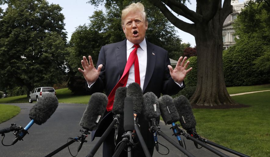 President Donald Trump&#39;s hair is ruffled by a breeze as he speaks to the media on the South Lawn of the White House in Washington, Wednesday, May 23, 2018, en route to a day trip to New York. Trump will hold a roundtable discussion on Long Island on illegal immigration and gang violence that the White House is calling a &quot;national call to action for legislative policy changes.&quot; (AP Photo/Jacquelyn Martin)