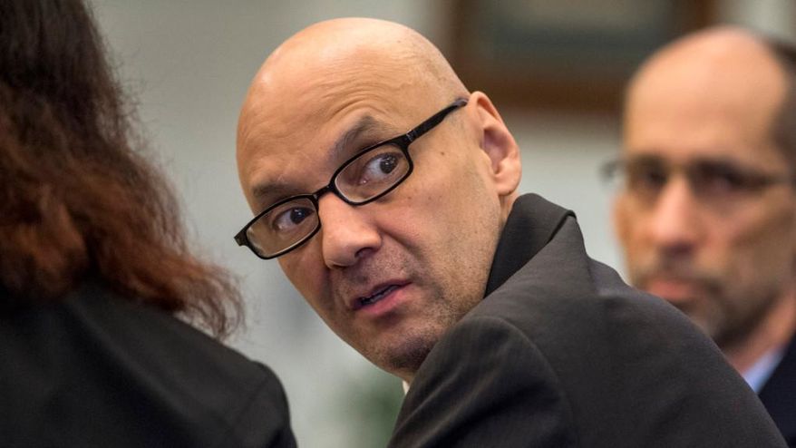 In this March 21, 2018 photo, Andrew Urdiales looks back into the courtroom gallery as opening statements began his trial in Santa Ana, Calif. Urdiales has been found guilty of the murders of five women in Southern California more than two decades ago. The Orange County District Attorney's Office says jurors on Wednesday, May 23, 2018, convicted Urdiales of five counts of murder with multiple enhancements. The verdict raises to eight the number of women killed by the 53-year-old former Marine. (Mindy Schauer/The Orange County Register via AP)