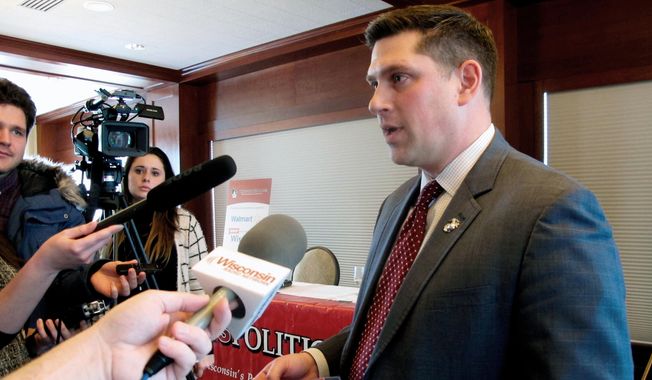 In this Jan. 30, 2018, file photo, Wisconsin Republican Senate candidate Kevin Nicholson speaks with reporters in Madison, Wis. Nicholson&#x27;s opponent in the Aug. 14, 2018, primary is state Sen. Leah Vukmir. Nicholson submitted his nomination papers to get on the ballot with the state Elections Commission on Tuesday, May 22, 2018. (AP Photo/Scott Bauer, File)