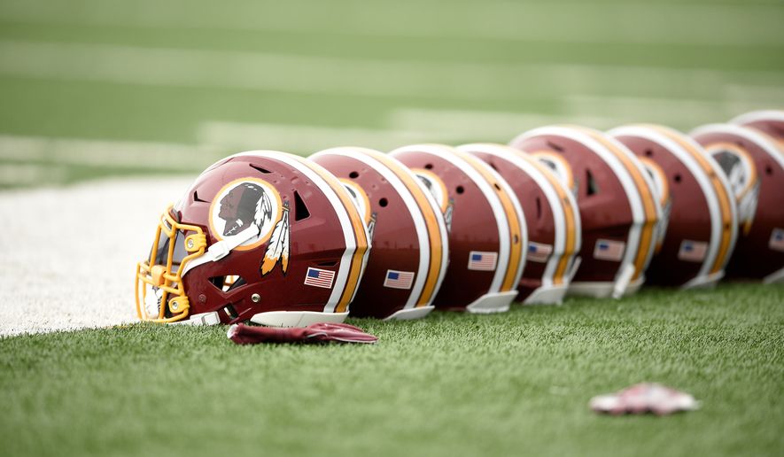 Washington Redskins football helmets are seen during an NFL football team practice, Wednesday, May 23, 2018, in Ashburn, Va. (AP Photo/Nick Wass) ** FILE **