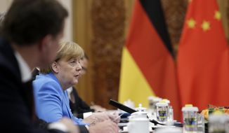 German Chancellor Angela Merkel attends a meeting with China&#39;s Premier Li Keqiang at the Great Hall of the People in Beijing, Thursday, May 24, 2018. (Jason Lee/Pool Photo vi AP)