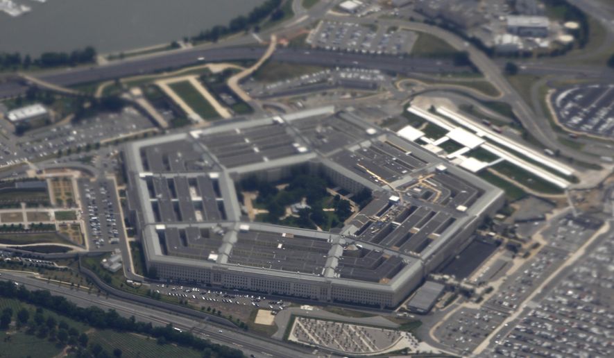 FILE - In this June 3, 2011, file photo, the Pentagon is seen from air from Air Force One.  The House has passed a $717 billion defense policy bill that would give the military a 2.6 percent pay hike, the largest in nine years.  (AP Photo/Charles Dharapak, File)