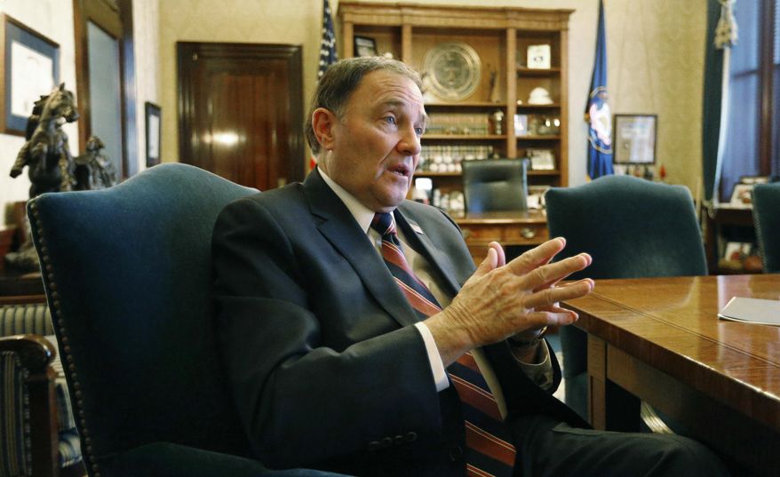 FILE - In this March 8, 2018, file photo, Utah Gov. Gary Herbert speaks during an interview at the Utah State Capitol, in Salt Lake City. Herbert  said at his monthly televised news conference at KUED Thursday, May 24, 2018, that he is open to changing the state's gun laws as one of other strategies to prevent violence at schools. While he supports the gun rights group's philosophy, he criticized its "heavy-handed tactics." (AP Photo/Rick Bowmer, File)