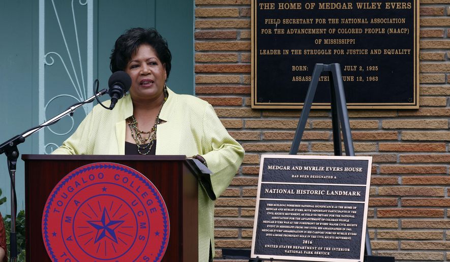Reena Evers-Everett, daughter of civil rights leaders Medgar and Myrlie Evers, delivers reflections on behalf of her family before the National Park Service presented a bronze plaque, right, showing the Jackson, Miss., Evers&#x27; home as a national historic landmark, Thursday, May 24, 2018. As the Mississippi NAACP&#x27;s first field secretary beginning in 1954, Medgar Evers led voter registration drives and boycotts to push for racial equality. He was assassinated in June 1963 outside the family&#x27;s modest ranch-style home. (AP Photo/Rogelio V. Solis)