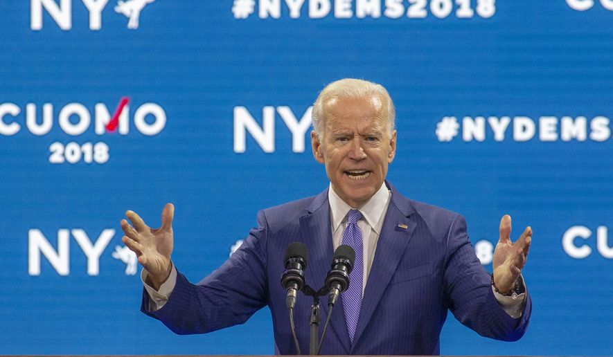 Former Vice President Joe Biden endorses New York Gov. Andrew Cuomo for reelection at opening day of the New York State Democratic Convention at Hofstra University in Hempstead, N.Y., Thursday, May 24, 2018. In a forceful rebuke to President Donald Trump and other Washington Republicans, Biden told fellow Democrats that the GOP has abandoned traditional American values in the name of "phony populism" and "fake nationalism." (Howard Schnapp/Newsday via AP)