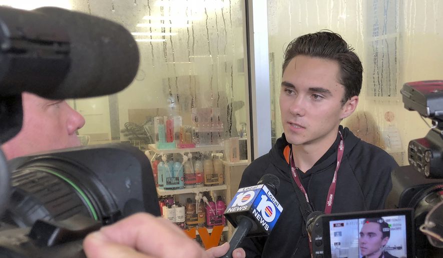 David Hogg, a student at Marjory Stoneman Douglas speaks outside a Publix Supermarket in Coral Springs, Fla., Friday, May 25, 2018. Students from the Florida high school where 17 people were shot and killed earlier this year plan a &quot;die in&quot; protest at a supermarket chain that backs a gubernatorial candidate allied with the National Rifle Association. Shortly before the the &quot;die-in &quot; Publix announced that is will suspect political donations. (AP Photo/Terry Spencer)