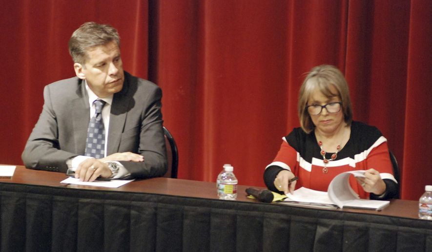 In this April 5, 2018 photo, candidates for New Mexico governor participate in a policy forum in Albuquerque, N.M., attended by state Sen. Joseph Cervantes, left, of Las Cruces, and U.S. Rep. Michelle Lujan Grisham of Albuquerque. New Mexico's next governor will inherit simmering discontent over teacher pay and evaluations, urgent calls to expand early childhood schooling and a lawsuit that may put the judiciary in charge of pivotal education funding decisions. (AP Photo/Morgan Lee)