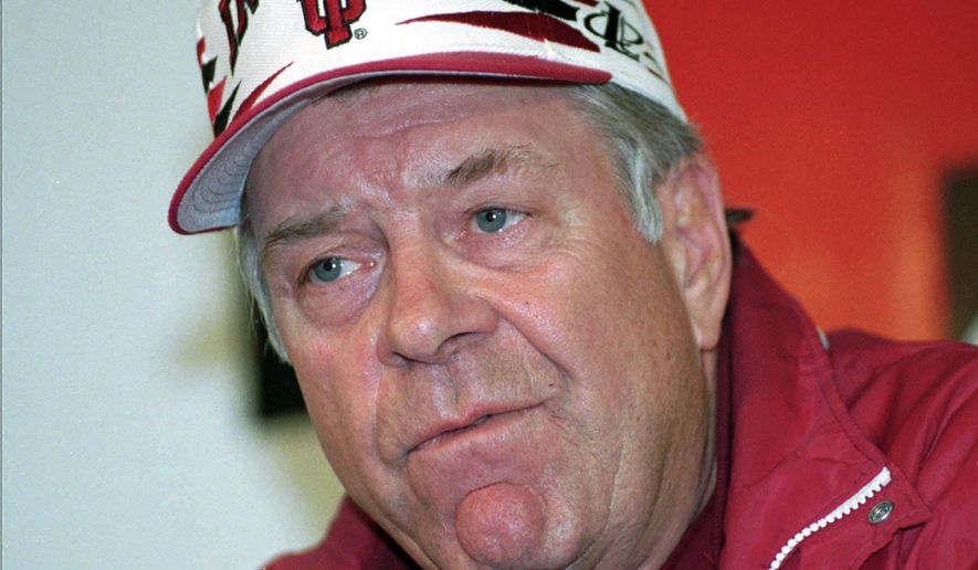 FILE - In this Oct. 31, 1996, file photo, Indiana University football coach Bill Mallory speaks at a news conference in Bloomington, Ind., after he was fired. Mallory, the winningest football coach in Indiana history who also led three other schools to bowl games, has died from a brain injury suffered in a recent fall. He was 83. (AP Photo/Chuck Robinson, File)