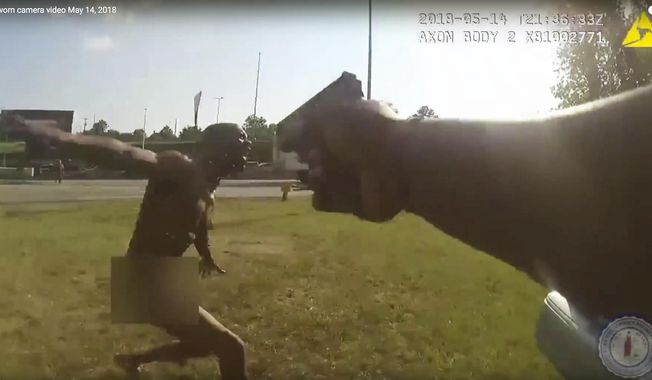 This still image taken from the Richmond, Va., Police body camera shows a police officer pointing his gun at Marcus-David Peters on May 14, 2018, in Richmond, Va. Police Chief Alfred Durham on Friday, May 25, released the video showing the officer first used a stun gun when Peters approached him. Police say it was not effective and the officer then shot Peters twice in the abdomen. (Richmond Police via AP)
