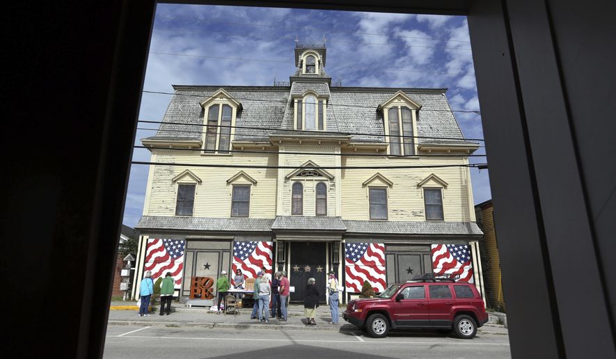 FILE - In this Sept. 13, 2014, file photo, fans gather outside "Star of Hope" the residence of artist Robert Indiana on Vinalhaven Island, Maine. Indiana died on May 19, 2018. His will calls for his home and studio to be transformed into a museum and for his collection to be preserved and open to the public. (AP Photo/Robert F. Bukaty, File)