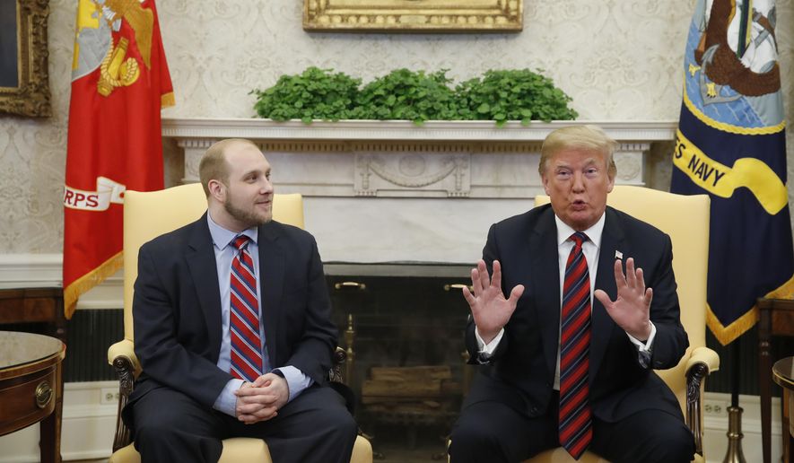 President Donald Trump, right, talks as Joshua Holt, who was recently released from a prison in Venezuela, joins him in the Oval Office of the White House, Saturday, May 26, 2018, in Washington. (AP Photo/Alex Brandon)