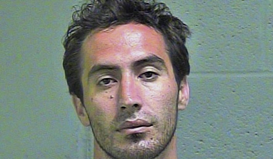 This undated photo provided by the Oklahoma County Sheriff's Office shows Travis Allen Jones. Jones, who pleaded guilty to aiming a laser pointer at an Oklahoma City Police Department helicopter, has ben sentenced to probation. Federal court records indicate that U.S. District Judge Joe Heaton sentenced 30-year-old Jones to three years’ probation on Tuesday, May 22, 2018. (Oklahoma County Sheiriff's Office via AP)