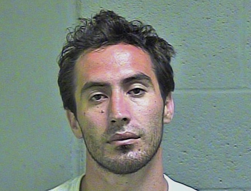 This undated photo provided by the Oklahoma County Sheriff's Office shows Travis Allen Jones. Jones, who pleaded guilty to aiming a laser pointer at an Oklahoma City Police Department helicopter, has ben sentenced to probation. Federal court records indicate that U.S. District Judge Joe Heaton sentenced 30-year-old Jones to three years’ probation on Tuesday, May 22, 2018. (Oklahoma County Sheiriff's Office via AP)