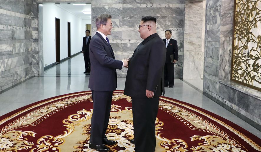 In this photo provided by South Korea Presidential Blue House via Yonhap News Agency, North Korean leader Kim Jong Un, right, and South Korean President Moon Jae-in, left, shake hands before their meeting at the northern side of the Panmunjom in North Korea, Saturday, May 26, 2018. Kim and Moon have met for the second time in a month to discuss peace commitments they reached in their first summit and Kim&#39;s potential meeting with President Donald Trump. (South Korea Presidential Blue House/Yonhap via AP)