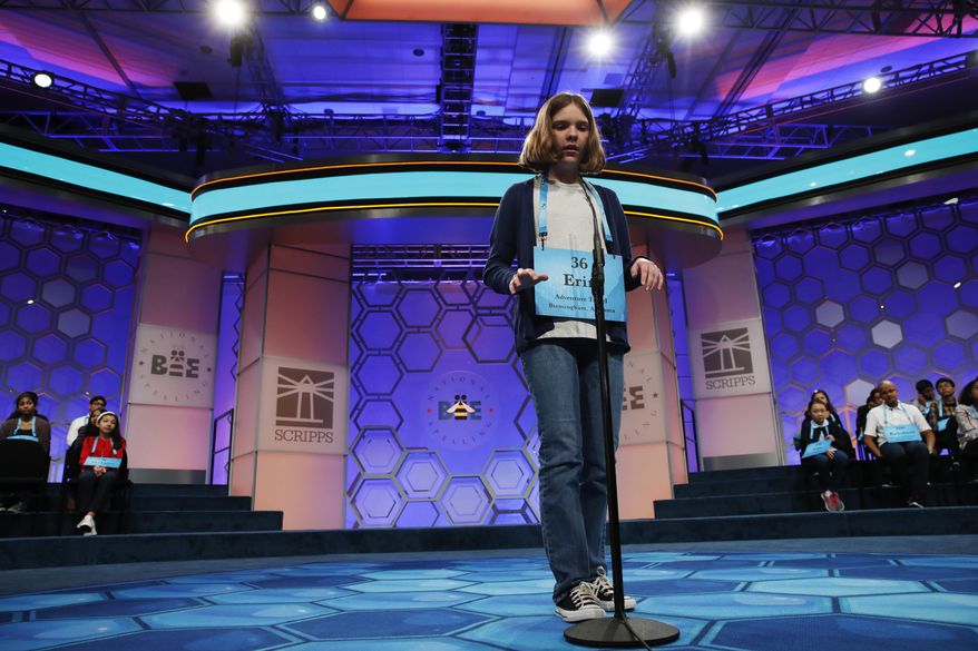 FILE - In this June 1, 2017 file photo, Erin Howard, 12, of Huntsville, Ala., "types" out her word in the air while competing in 90th Scripps National Spelling Bee in Oxon Hill, Md. This year’s super-sized bee, starting Tuesday, May 29, 2018 has three full days of spelling because Scripps allowed wild cards into the field for the first time. How the 516 competitors manage stress could play a bigger role than ever in who wins.(AP Photo/Jacquelyn Martin, File)