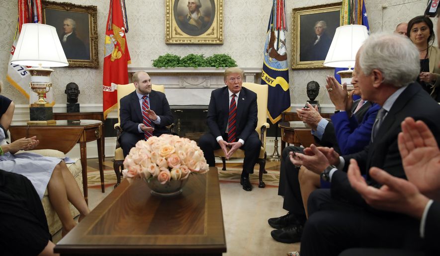 President Donald Trump, second from right, speaks as he sits with Joshua Holt, left who was recently released from a prison in Venezuela, with Sen. Bob Corker, R-Tenn., right, and others, in the Oval Office of the White House, Saturday, May 26, 2018, in Washington. (AP Photo/Alex Brandon)