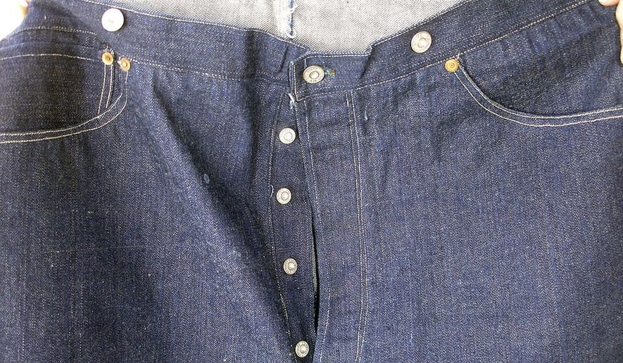 This undated photo provided by Daniel Buck Auctions, of Lisbon Falls, Maine, shows a portion of a pair of 125-year-old Levi Strauss &amp;amp; Co., denim blue jeans that sold for nearly $100,000 this in May 2018 to a buyer in Asia. The jeans were purchased in 1893 by a store keeper in the Arizona Territory and were in pristine condition because they were worn only a few times. (Daniel Buck Soules/Daniel Buck Auctions via AP) ** FILE **