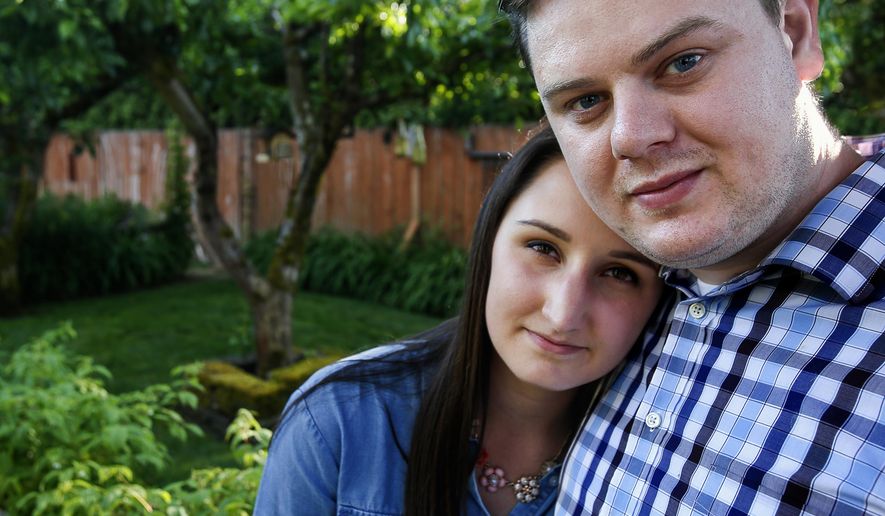 In a May 21, 2018 photo, Bryan and April Fugate talk about his treatment for schizophrenia and how it has affected their lives. The couple, Marysville natives and former high school sweethearts, will soon walk in a fundraising event to benefit mental illness programs. (Dan Bates/The Herald via AP)