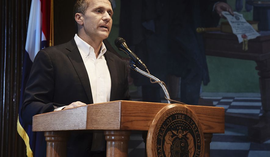 Missouri Gov. Eric Greitens reads from a prepared statement as he announces his resignation during a news conference, Tuesday, May 29, 2018, at the state Capitol, in Jefferson City, Mo. Greitens resigned amid a widening investigation that arose from an affair with his former hairdresser. Greitens said his resignation would take effect Friday. (Julie Smith/The Jefferson City News-Tribune via AP)