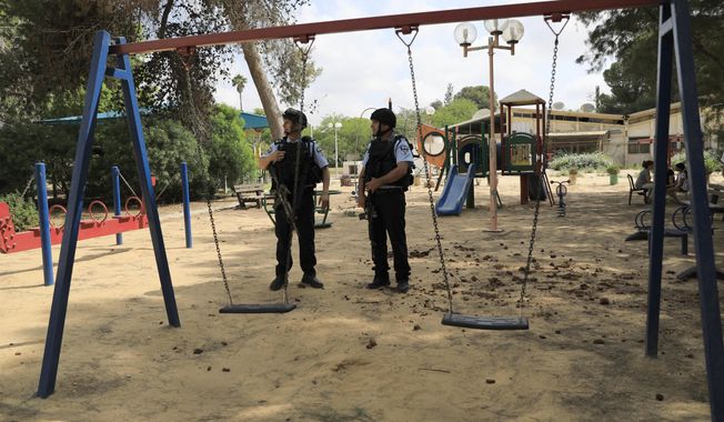 Israeli police officers guarded a playground near the Israel and Gaza border last month after Gaza militants fired more than 25 mortar shells toward communities in the south. The Israeli military said it appeared to be the largest single barrage fired since the 2014 Israel-Hamas war. (Associated Press)