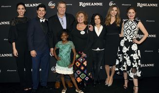 FILE - In this March 23, 2018 file photo, from left, Whitney Cummings, Michael Fishman, John Goodman, Jayden Rey, Roseanne Barr, Sara Gilbert, Sarah Chalke and Emma Kenney arrive at the Los Angeles premiere of &amp;quot;Roseanne&amp;quot; in Burbank, Calif.  ABC has canceled its hit reboot of &amp;quot;Roseanne&amp;quot;, Tuesday, May 29,  following Roseanne Barr&#39;s racist tweet about former Obama adviser Valerie Jarrett. ABC Entertainment President Channing Dungey says the comment &amp;quot;is abhorrent, repugnant and inconsistent with our values, and we have decided to cancel the show.&amp;quot;  (Photo by Jordan Strauss/Invision/AP, File)