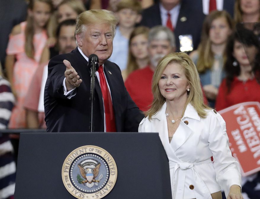 President Donald Trump introduces Rep. Marsha Blackburn, R-Tenn., at a rally Tuesday, May 29, 2018, in Nashville, Tenn. (AP Photo/Mark Humphrey)