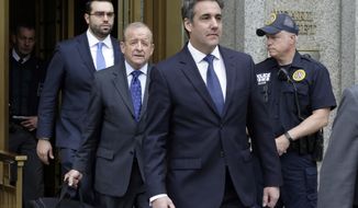 President Donald Trump&#39;s personal attorney Michael Cohen, right, leaves Federal Court, in New York, Wednesday, May 30, 2018. U.S. District Judge Kimba Wood said at a hearing Wednesday that she had to balance the needs of lawyers for Cohen and Trump with the needs of criminal prosecutors. (AP Photo/Richard Drew)