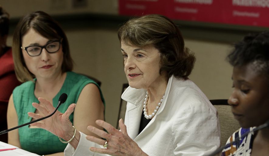 U. S. Sen. Dianne Feinstein, D-Calif., speaks at a gathering for Planned Parenthood, as Crystal Strait, left, chief executive officer and president of Planned Parenthood Affiliates of California looks on, Thursday, May 31, 2018, in Sacramento, Calif. (AP Photo/Rich Pedroncelli)
