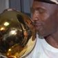 Michael Jordan of the Chicago Bulls kisses the NBA championship trophy after the Bulls defeated the Seattle SuperSonics 87-75 to win the NBA Championship Sunday, June 16, 1996, in Chicago.  (AP Photo/Mike Fisher)