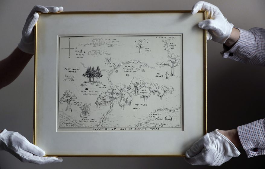 The original map of Winnie the Pooh's Hundred Acre Wood by E.H. Shepard is displayed at Sotheby's auction rooms in London, Thursday, May 31, 2018. The map, unseen for half a century is estimated at 100,000-150,000 UK pounds (133,200-199,800 US dollars) and will be auctioned on July 10 with four other original Winnie the Pooh illustrations. (AP Photo/Kirsty Wigglesworth)